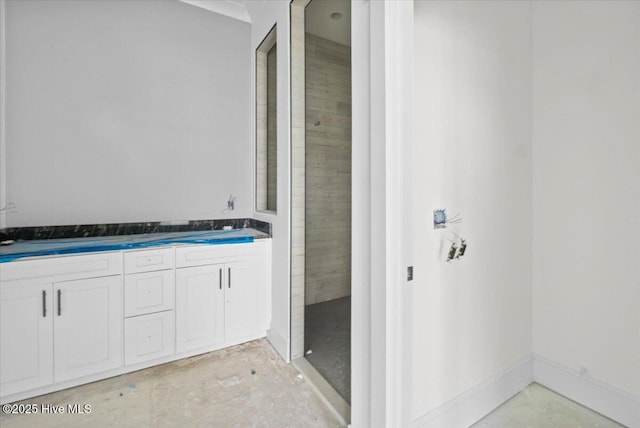 bathroom featuring concrete flooring