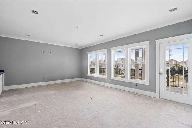 unfurnished living room with ornamental molding