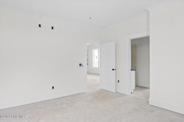 unfurnished room featuring crown molding