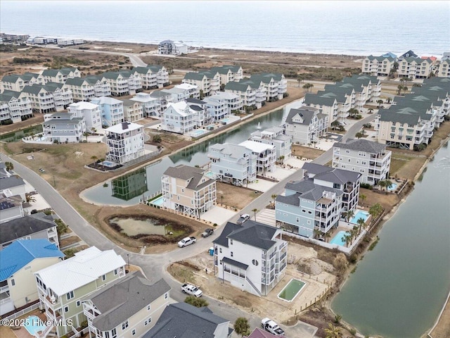 drone / aerial view with a water view