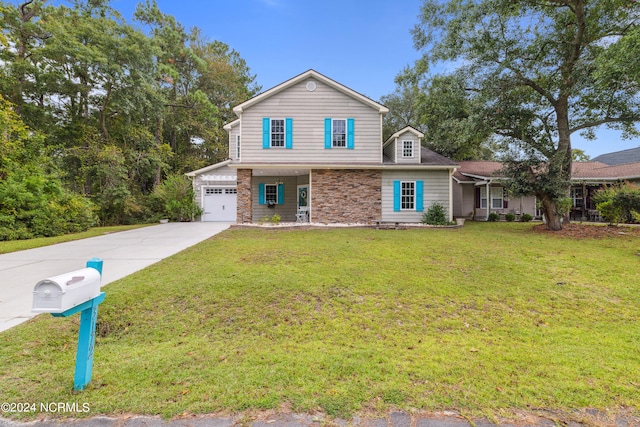 view of front of house featuring a garage and a front lawn