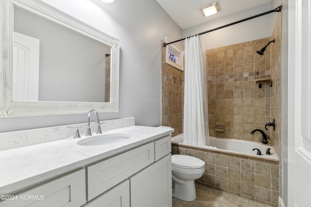 full bathroom with tile patterned flooring, vanity, toilet, and shower / bath combo with shower curtain