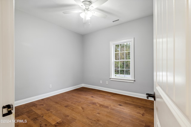 empty room featuring wood-type flooring and ceiling fan