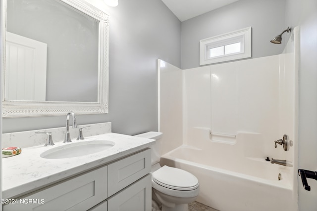 full bathroom featuring  shower combination, vanity, and toilet