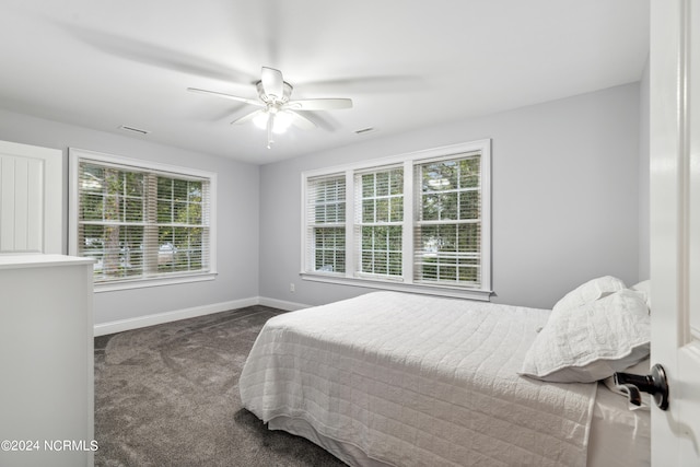 carpeted bedroom featuring ceiling fan