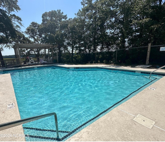 view of pool featuring a pergola