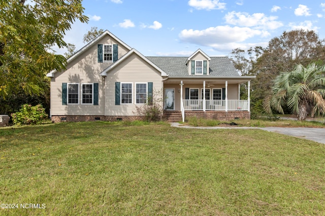 view of front of home featuring covered porch and a front lawn