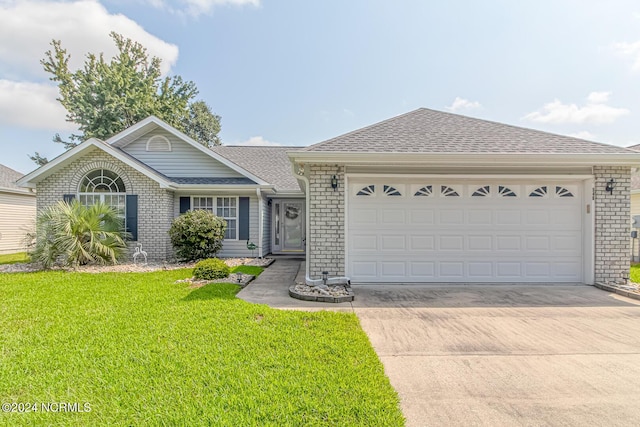 ranch-style house featuring a shingled roof, concrete driveway, brick siding, and a front lawn