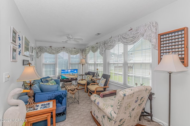 sunroom / solarium featuring visible vents and a ceiling fan