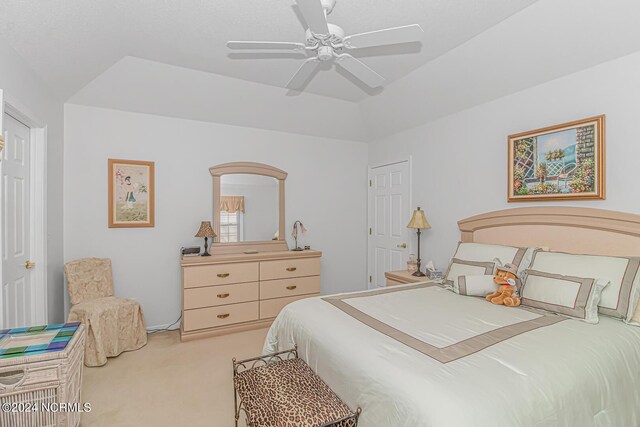 bedroom with ceiling fan and light carpet