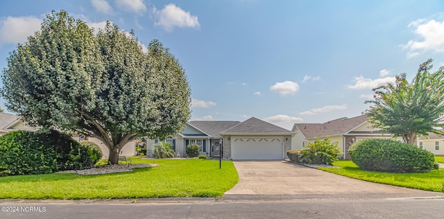 view of front of house with a garage and a front yard