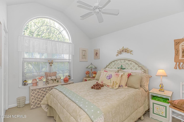 bedroom featuring carpet, baseboards, vaulted ceiling, and a ceiling fan