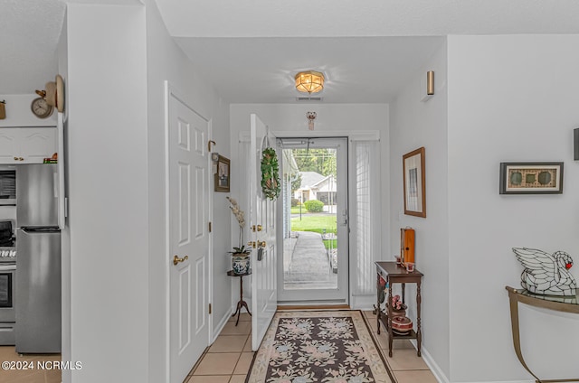 entrance foyer with light tile patterned flooring