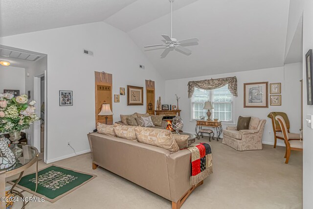 carpeted living room featuring ceiling fan and high vaulted ceiling