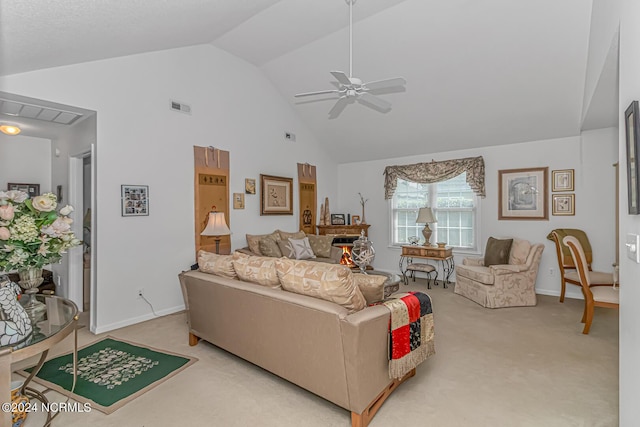 living room featuring light carpet, visible vents, a ceiling fan, a lit fireplace, and high vaulted ceiling