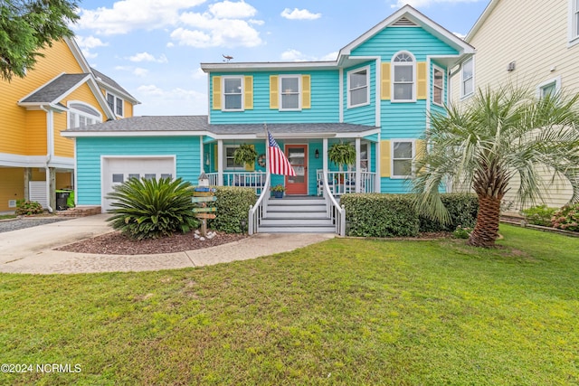 view of front of home with a garage, driveway, a porch, and a front yard