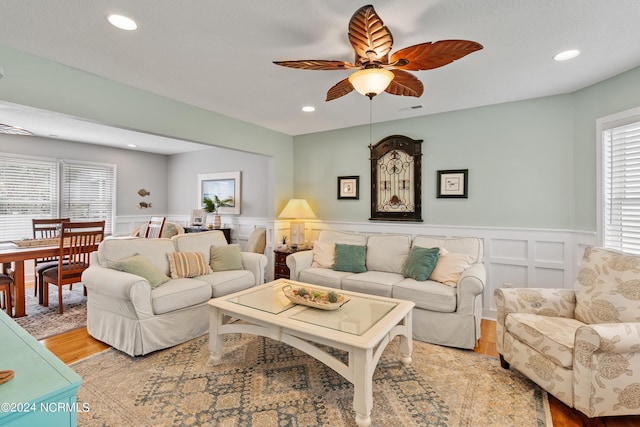 142 Carolina Ave, Holden Beach, NC 28462 - living area featuring light wood-style flooring, a wainscoted wall, ceiling fan, recessed lighting, and a decorative wall