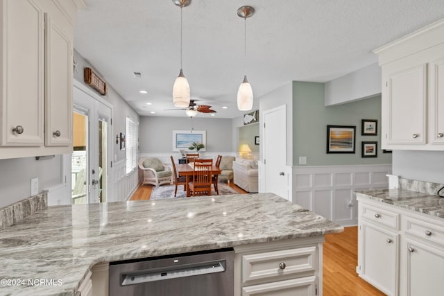 kitchen with dishwashing machine, light wood-style flooring, open floor plan, a peninsula, and white cabinetry