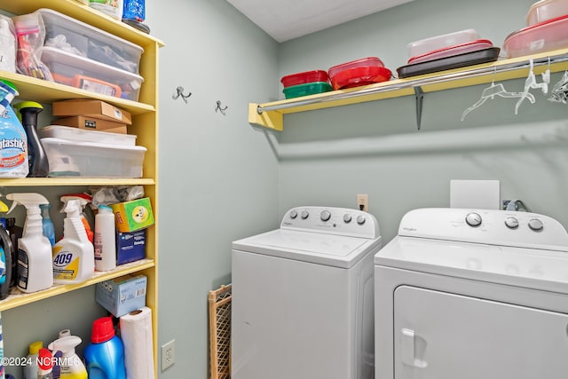 clothes washing area featuring laundry area and separate washer and dryer