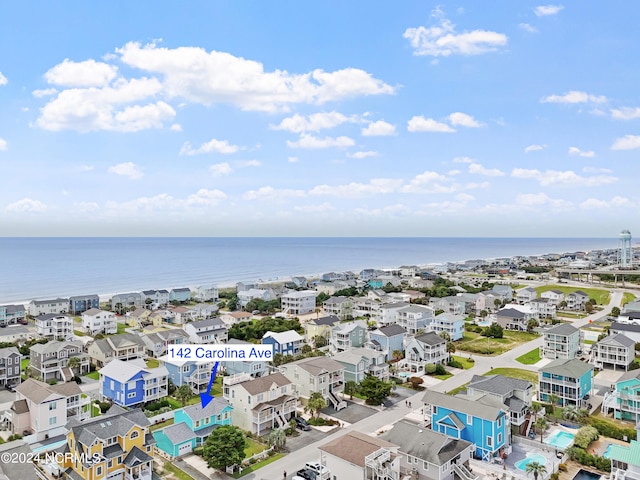 bird's eye view featuring a residential view and a water view