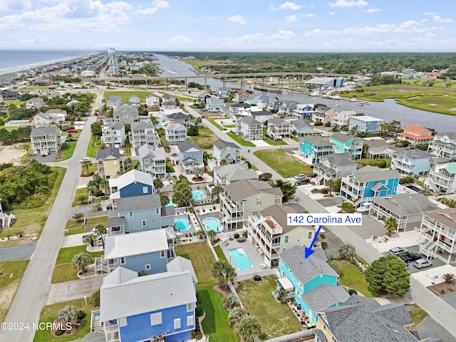 142 Carolina Ave, Holden Beach, NC 28462 - aerial view of residential area with a nearby body of water and a pool