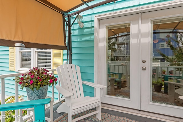 view of exterior entry featuring french doors