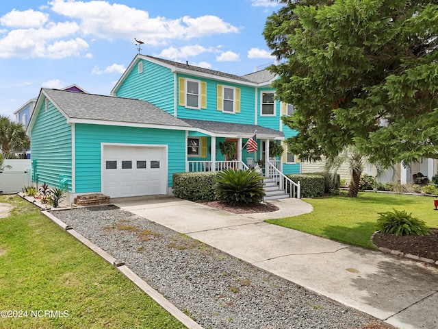 view of front facade with a porch, a garage, driveway, roof with shingles, and a front lawn