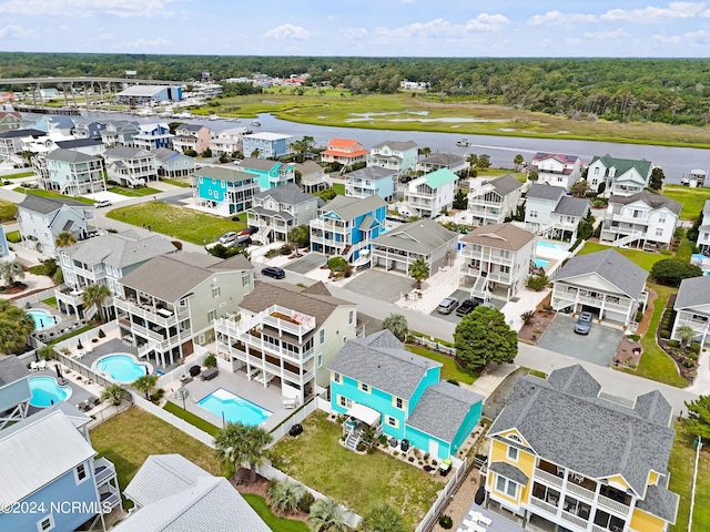 142 Carolina Ave, Holden Beach, NC 28462 - aerial view of residential area featuring a pool area and a large body of water