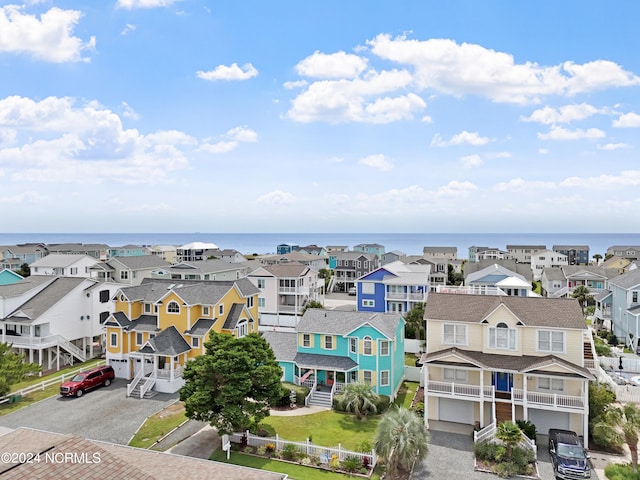 bird's eye view with a residential view and a water view