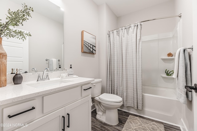 full bathroom featuring shower / bath combination with curtain, toilet, wood-type flooring, and vanity