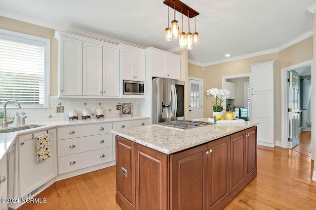 kitchen featuring sink, white cabinets, and stainless steel appliances