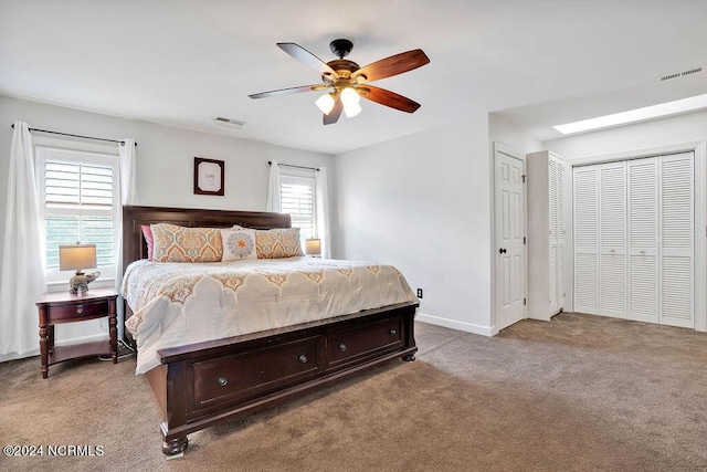 bedroom featuring light colored carpet and ceiling fan