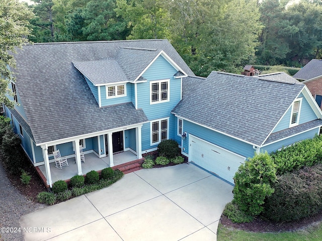 view of front of property featuring a garage and covered porch