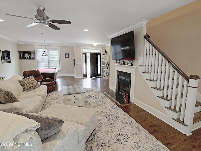 living room featuring ceiling fan, dark hardwood / wood-style floors, billiards, and crown molding