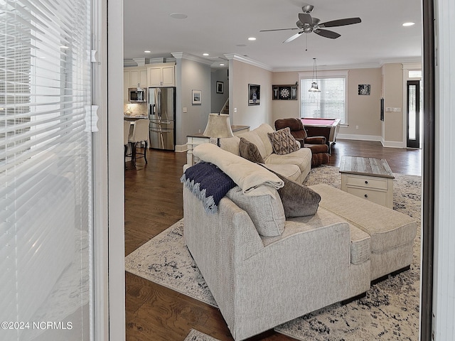 living room with crown molding, ceiling fan, dark wood-type flooring, and billiards