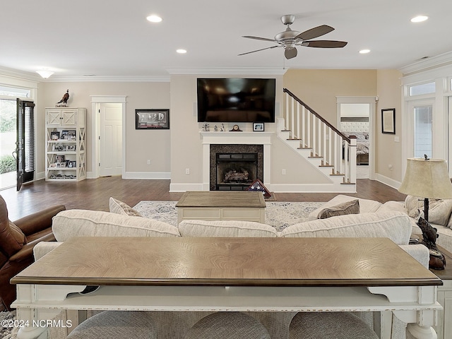 living room with ceiling fan, hardwood / wood-style floors, and crown molding