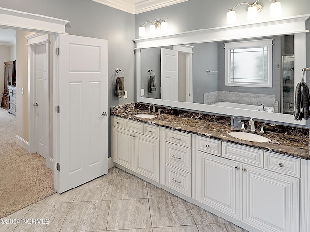 bathroom featuring independent shower and bath, vanity, and crown molding