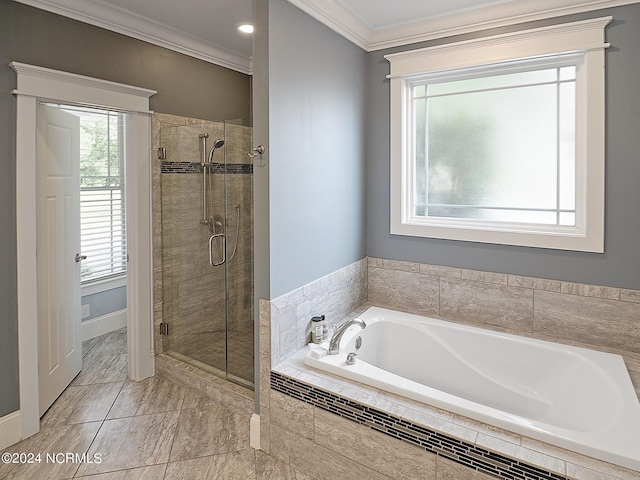 bathroom featuring crown molding and separate shower and tub