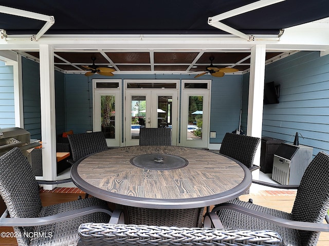 view of patio / terrace featuring ceiling fan and french doors