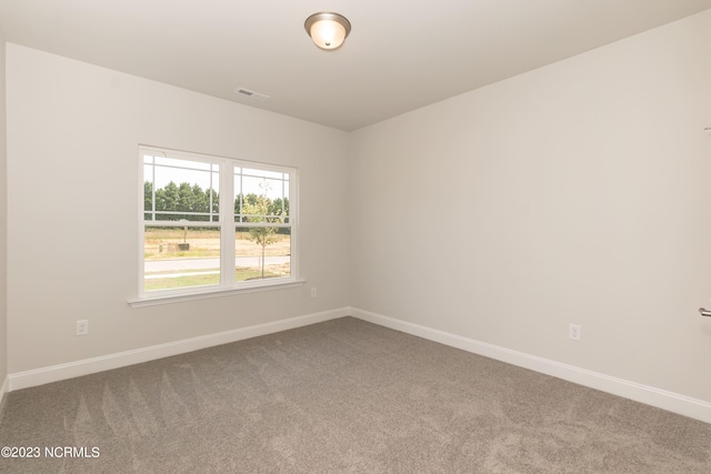 unfurnished room featuring carpet