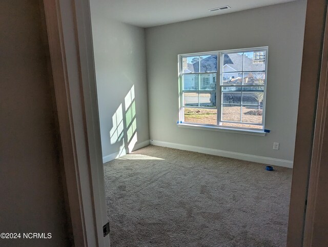 view of carpeted spare room