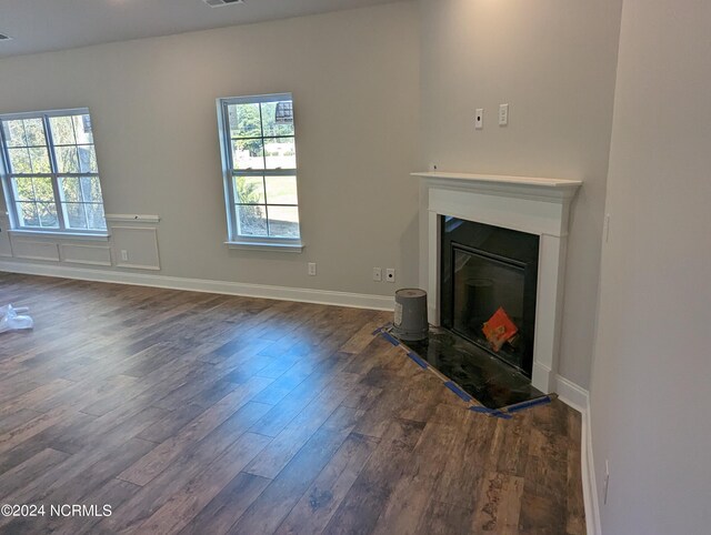 living room with dark hardwood / wood-style flooring