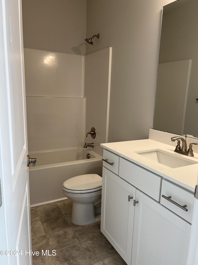 full bathroom with vanity, toilet, and washtub / shower combination