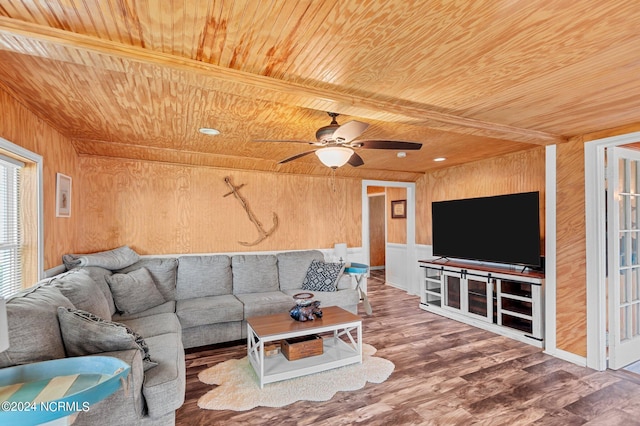 living room featuring wooden ceiling, hardwood / wood-style floors, wood walls, and ceiling fan