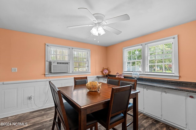 dining room featuring dark wood-type flooring, cooling unit, and ceiling fan