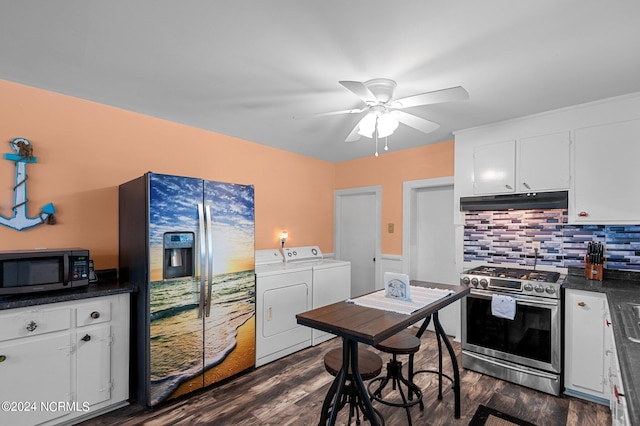 kitchen with dark hardwood / wood-style floors, appliances with stainless steel finishes, white cabinetry, washing machine and dryer, and ceiling fan