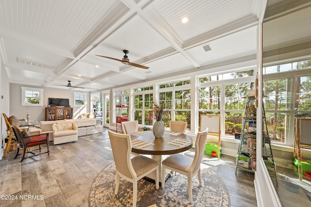 sunroom with beamed ceiling, coffered ceiling, visible vents, and a ceiling fan