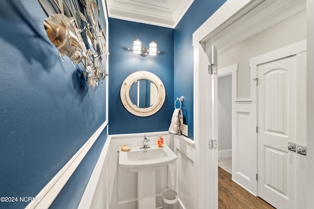 bathroom featuring crown molding and wood finished floors