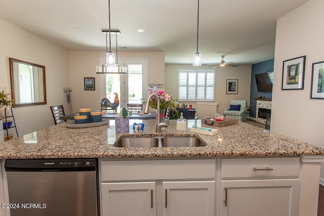 kitchen featuring sink, white cabinets, stainless steel dishwasher, and ceiling fan