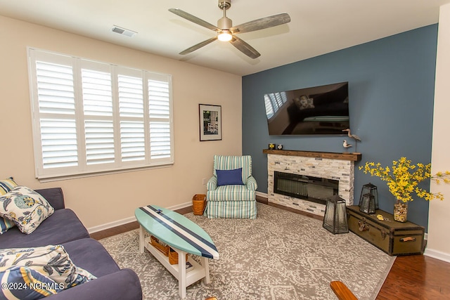 living room with hardwood / wood-style flooring and ceiling fan